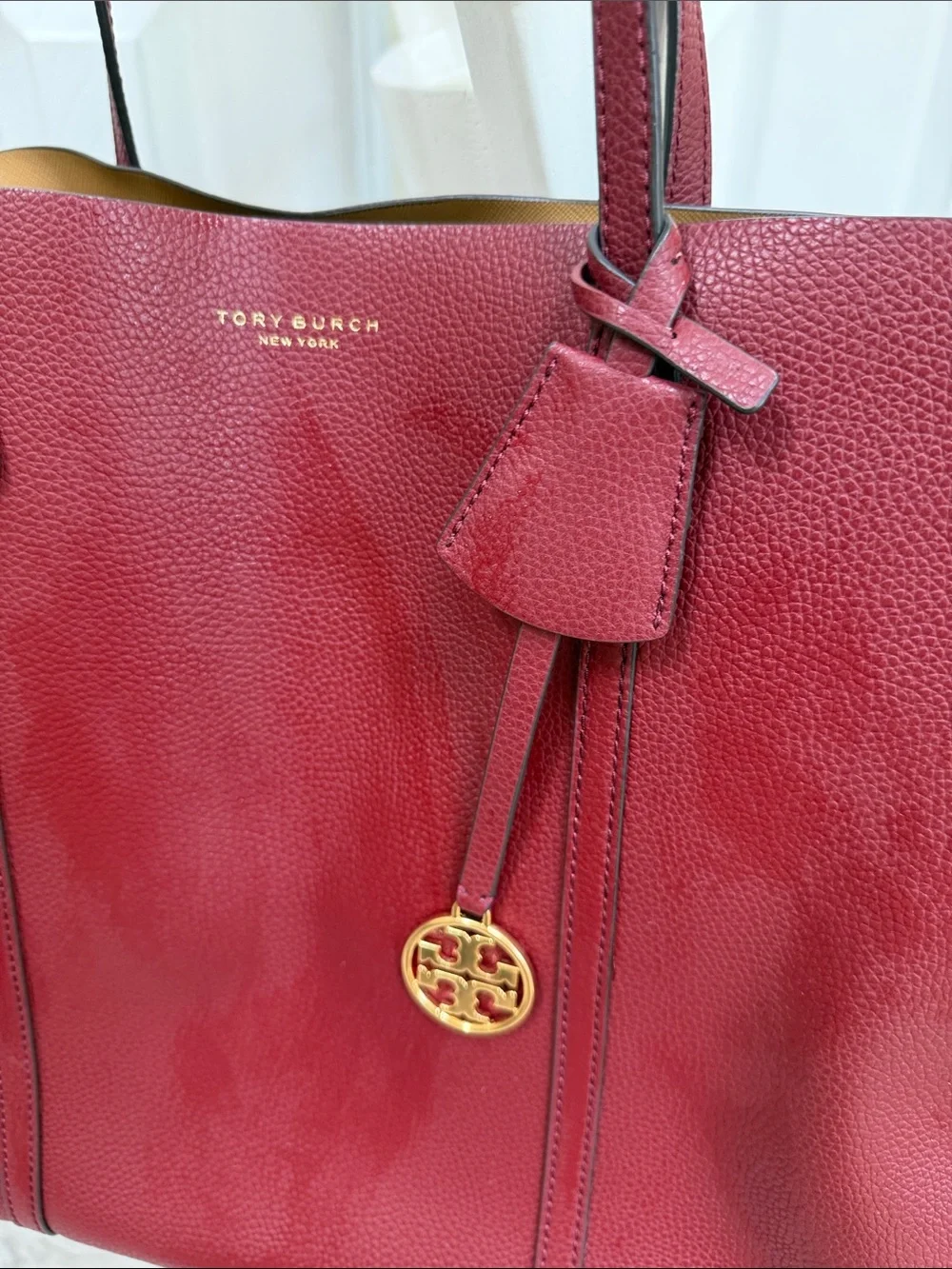 Tory Burch Wine Red Pebbled Leather Tote with Gold Logo Charm